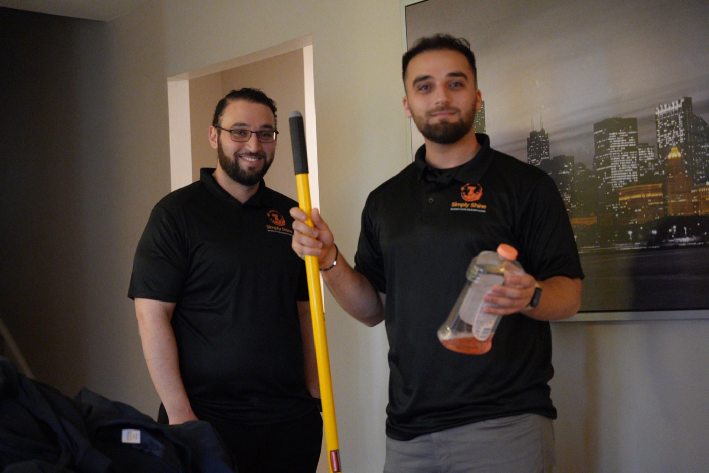 Simply Shine staff with professional cleaning supplies